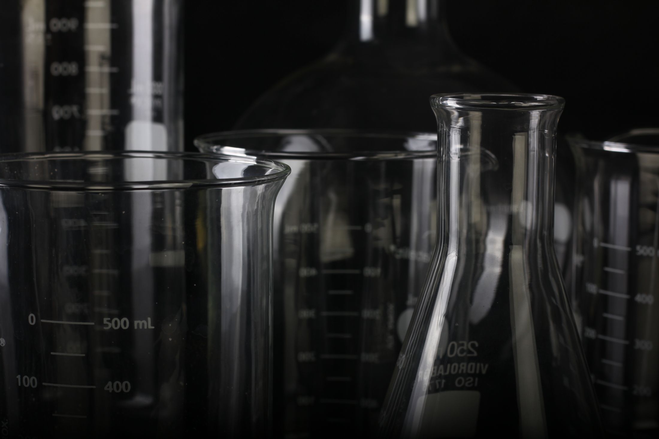 Laboratory glassware in a dark research lab