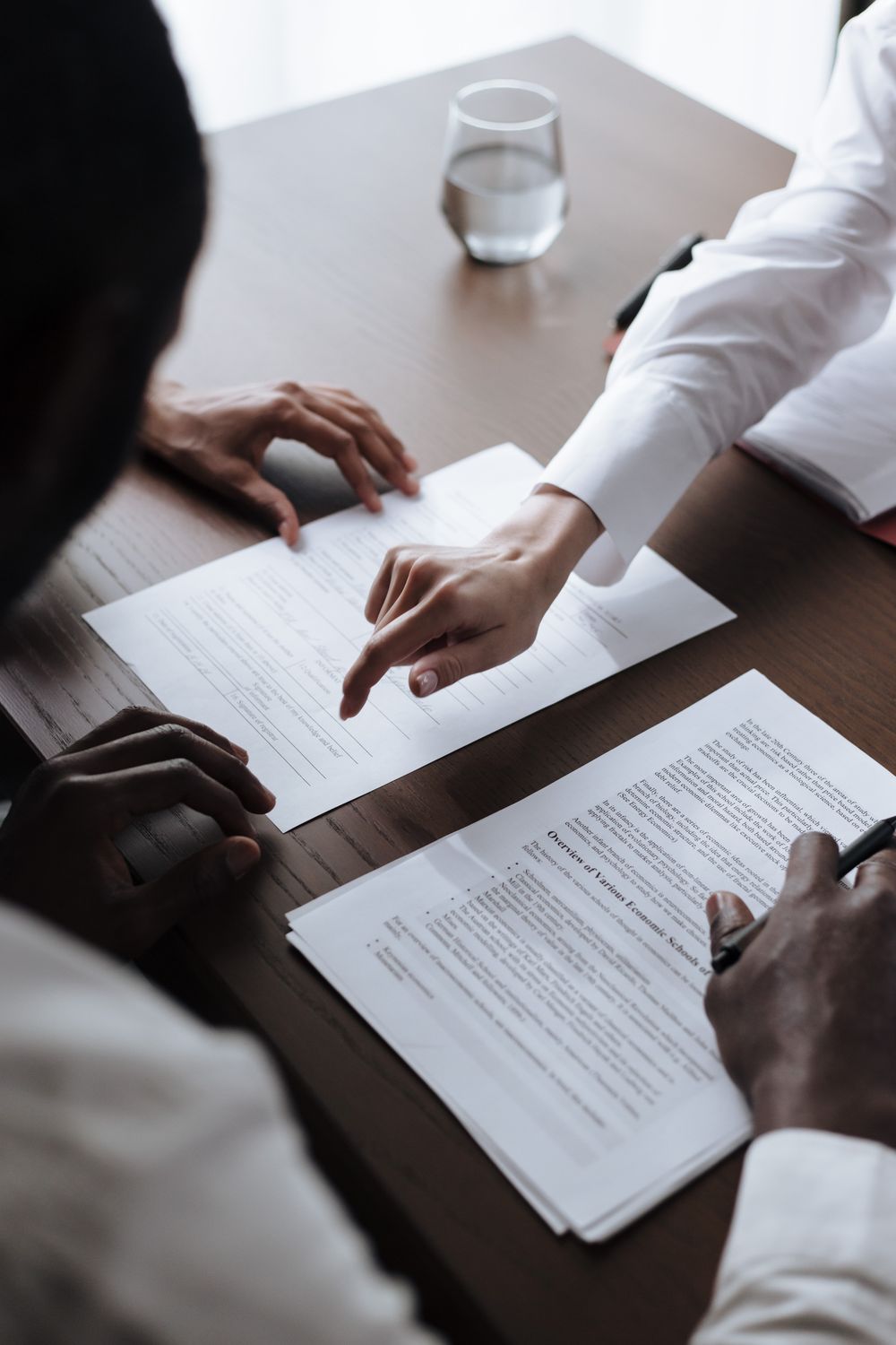 Consultant and client reviewing a prepared claim document